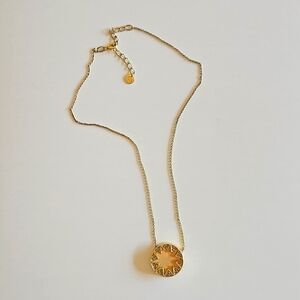 House of Harlow 1960 gold starburst necklace inlaid with dark crystals